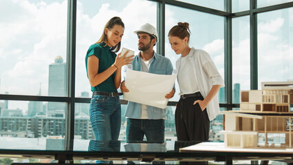 Professional architect engineer team talking, sharing, brainstorming about design while manager...