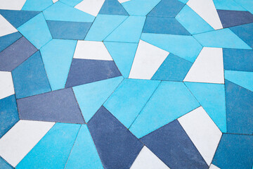 A blue and white tile floor with a captivating geometric pattern