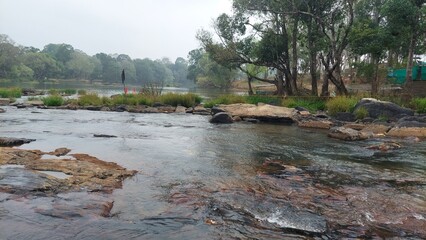 The river kaveri at the Dubare elephant camp at Dubare, Kodagu district, Karnataka, India. People used to cross this river by walk during low level of water to visit elephant camp. 
