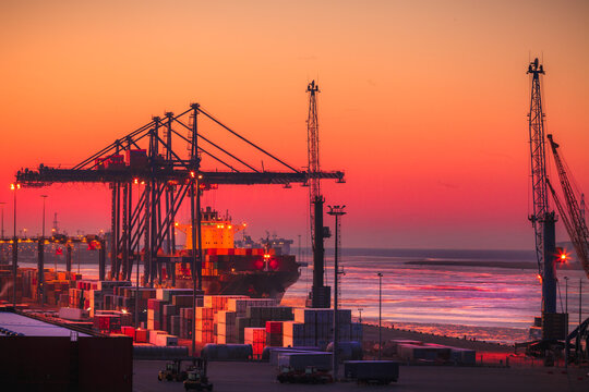 Silhouette of shipping containers and cranes at the port of Klaipeda, Lithuania