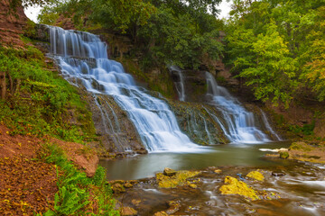 Obraz premium beautiful waterfall on mountain brook flow through canyon