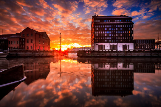 Waterfront building reflections in the Dane river at sunrise, Klaipeda, Lithuania