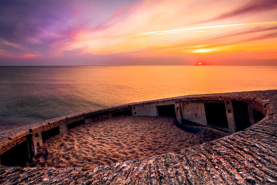 Sunset over an abandoned bunker near the gates to the port of Klaipeda, Lithuania