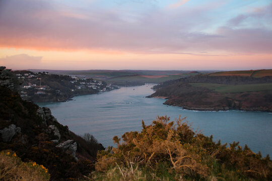 Salcombe Estuary landscape with sailing in the evening sunset 