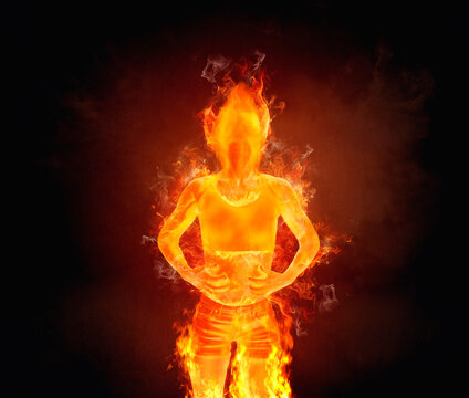 Conceptual woman on fire with her hands on her stomach