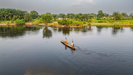 Aerial of a dugout canoe on the Congo River, Mbandaka, Equateur province, Democratic Republic of Congo, Africa
