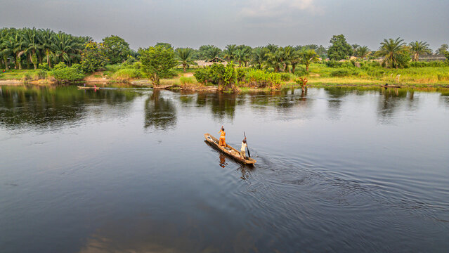 Aerial of a dugout canoe on the Congo River, Mbandaka, Equateur province, Democratic Republic of Congo, Africa