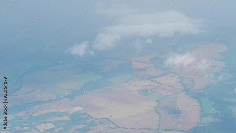 Poster flight in clouds over italian mainland during changeable cloudy and sunny summer weather with scrap 