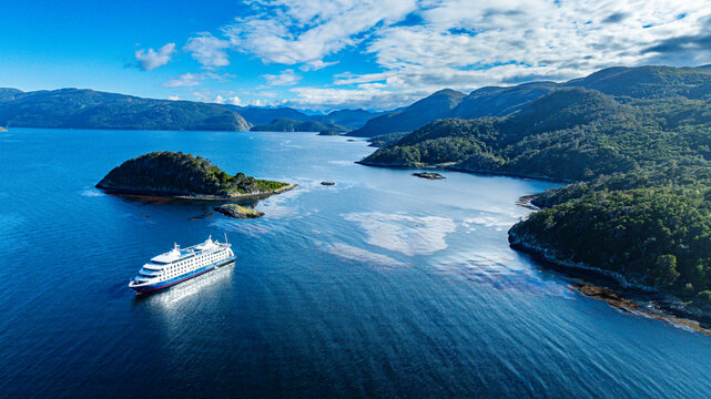 Cruise ship anchoring in Wulaia Bay, Tierra del Fuego, Chile - Powered by Adobe