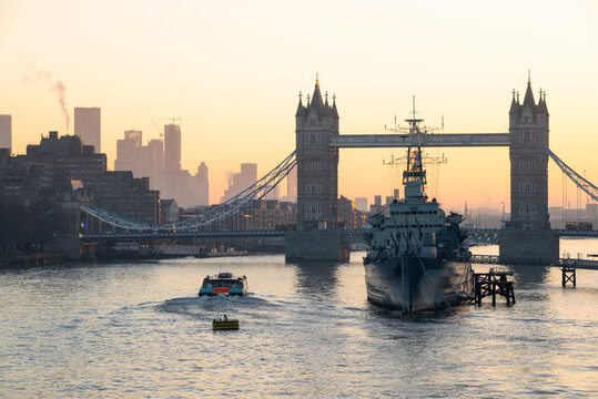 Tower Bridge and HMS Belfast at sunrise, River Thames, London, England, United Kingdom
