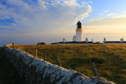 Dunnet Head Lighthouse at summer solstice sunrise, Caithness, Highlands, Scotland, United Kingdom