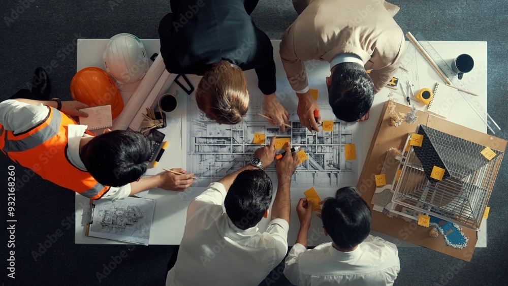 Aufkleber top down view of skilled engineer team compare between blueprint and house plan. aerial view of grou