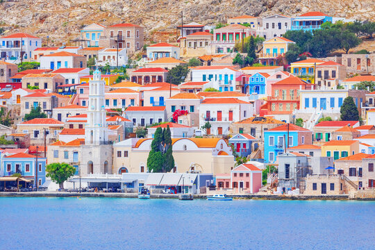 View of Emporio harbour and Saint Nicholas church in the distance, Emporio, Halki Island, Dodecanese Islands, Greek Islands, Greece