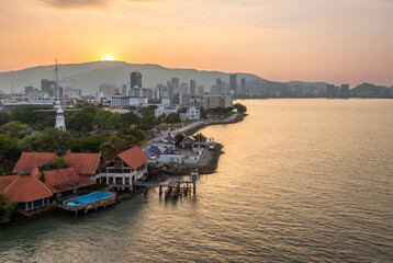 Naklejka premium Exposure done at sunset, from a ship of the downtown and port area of Penang, Malaysia