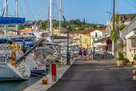 View of boats and cafes in the harbour in Gaios Town, Paxos, Ionian Sea, Greek Islands, Greece