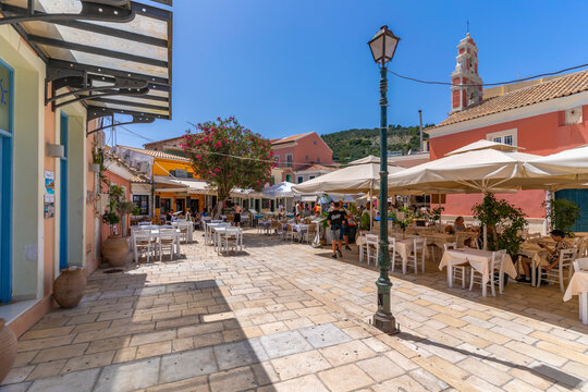 View of cafes and Ascension of the Lord Holy Orthodox Church in Gaios Town, Paxos, Ionian Sea, Greek Islands, Greece