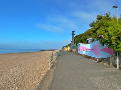 Beach huts along the promenade on Mermaid Beach, Folkestone, Kent, England, UK