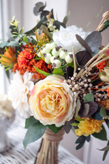 Colorful bridal bouquet. bridal bouquet with yellow and orange flowers	