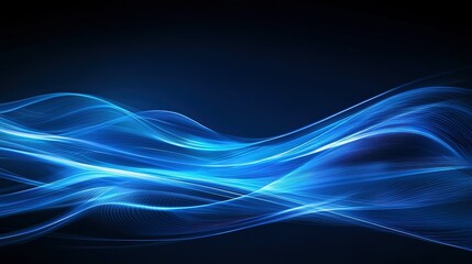 Abstract blue waves representing movement and energy on a dark background