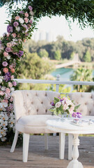 Wedding dais. Wedding ceremony area. Pink color flowers are decorated with a seat