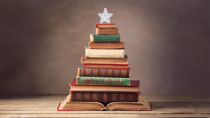 Christmas Tree Made out of a Stack of Vintage Antique Books with a Star on Top