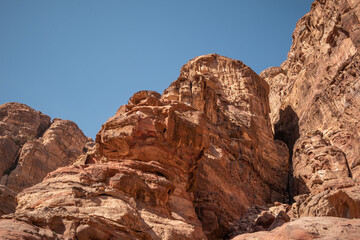 Red Sandstone Rock in Jordan. Outdoor Scene of Rock Sandstone with Blue Sky in Petra. 