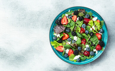 Berries salad (blueberry strawberry blackberry ) with cheese feta and balsamic sauce