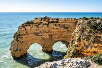 Praia da Marinha Beach among rock islets and cliffs seen from Seven Hanging Valleys Trail, Algarve,...