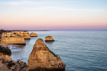 Praia da Marinha Beach among rock islets and cliffs seen from Seven Hanging Valleys Trail, Algarve,...