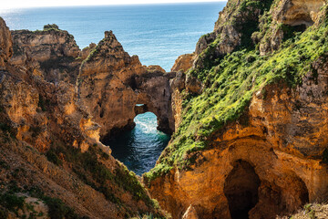 Ponta da Piedade is a unique rock formation with famous grottos in the ocean at Lagos, Algrave,...