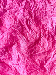 Pink crumpled paper background, backing, backdrop for creativity