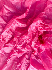 Pink crumpled paper background, backing, backdrop for creativity