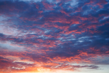 Pink and blue clouds at sunset