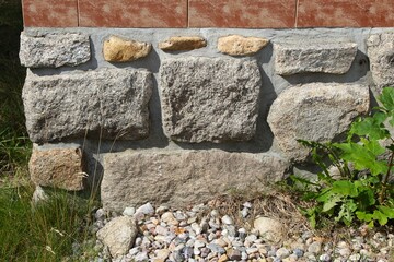 Stone underpinning. Wall base.