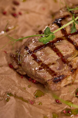 Indulge in a Delicious Grilled Steak Artfully Presented on a Wooden Serving Board