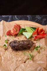 Indulge in a Delicious Grilled Steak Artfully Presented on a Wooden Serving Board