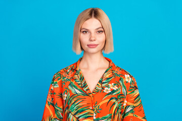 Photo of charming lovely girl wear stylish orange print clothes isolated on blue color background