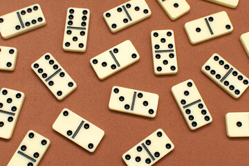 Dominoes bones on brown background	