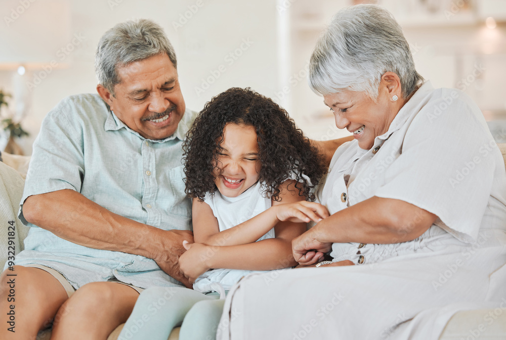 Wall mural Happy, grandparents and tickling child in home for funny joke, playful and bonding on weekend. Family, house and game with girl on sofa for retirement, humor and laughter in connection together