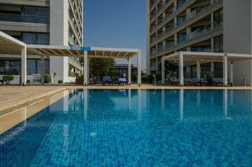 Modern living room and patio next to swimming pool