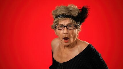 Portrait of afraid, troubled elderly senior old woman covering her eyes scared with wrinkled skin...
