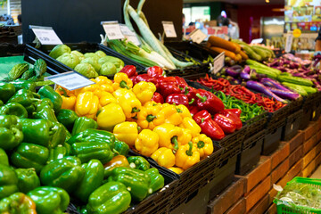 An assortment of fresh ripe colorful vegetables in an Asian supermarket.