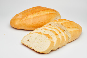 Freshly baked white bread loaf, sliced and ready to serve, perfect for sandwiches and breakfast