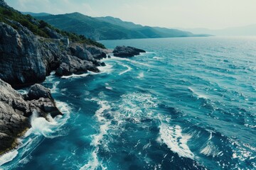 Fototapeta premium A scenic view of a body of water near a rocky shore, suitable for use in travel or nature-themed projects