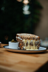 sandwich in a restaurant melted cheese