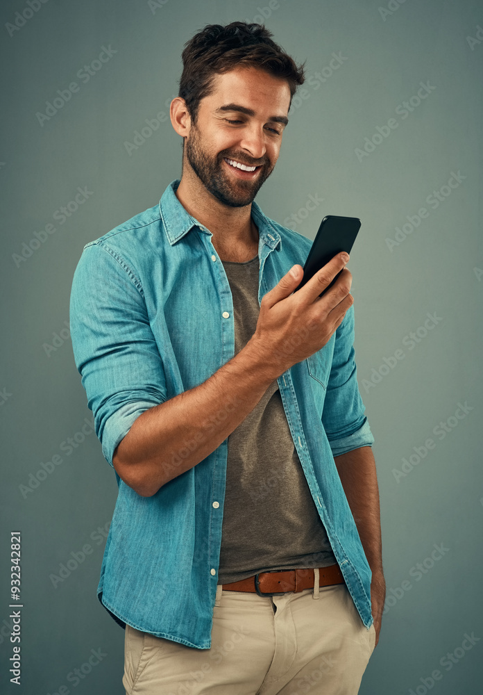 Poster Business, man and happy with phone for reading email, notification or laughing for funny text message. Employee, smile and person with smartphone for social media video or meme with studio background