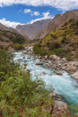Flowing river with rocky surroundings view