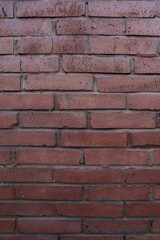 Dark red brick texture on the wall
