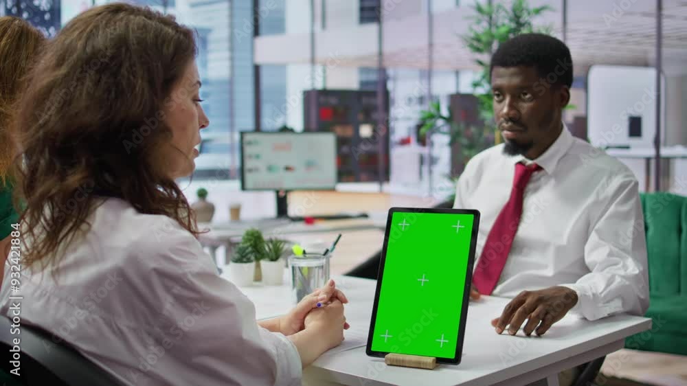 Poster interviewer and candidate meeting for an interview next to green screen, hr manager asking questions
