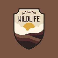 Wildlife logo design with nature landscape. Camping badge graphics in retro style. Travel colorful emblem. Stock label